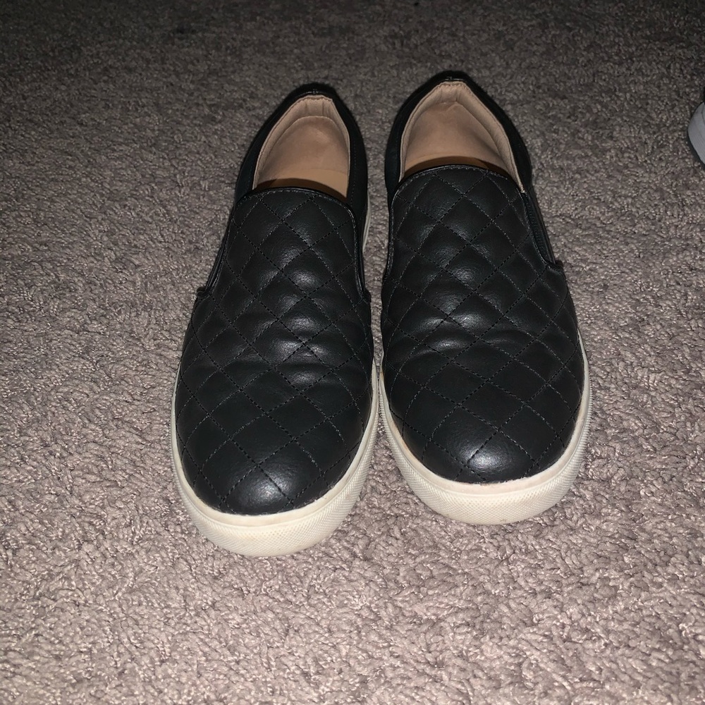 Black quilted slip ons